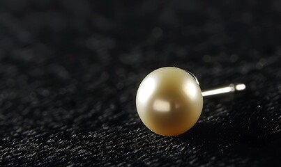 Pearl on Black Fabric with Bokeh Background