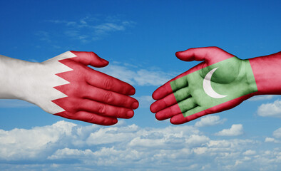 Maldives and Bahrain country handshaking with flags, consensus concept international co-operation illustration