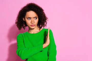 Photo of lovely confident woman wear green stylish clothes stop sign empty space isolated on pink...