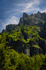 Peak landscape and waterfall in the Alps, with rocky mountain and waterfall.