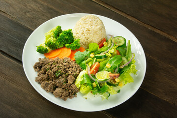 Healthy Plate with Ground Beef, Brown Rice, Vegetables, and Fresh Salad