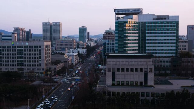 DAEJEON, SOUTH KOREA. Aerial view of skyscrapers in Daejeon, South Korea during a sunset, from day to шпре time-lapse. Zoom in