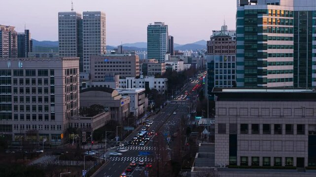 DAEJEON, SOUTH KOREA. Aerial view of skyscrapers in Daejeon, South Korea during a sunset, from day to шпре time-lapse. Panning video