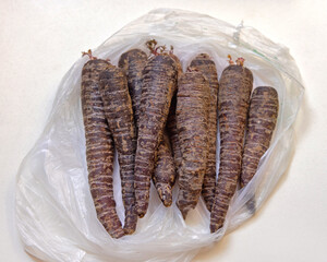 Unusual Organic Purple Carrots Root Vegetables in Bag