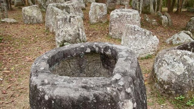 The Plain of Jars site 3.Laos forest. Megalithic archaeological landscape consists of thousands of stone jars scattered around the upland valleys lower foothills central plain - Xiangkhoang Plateau