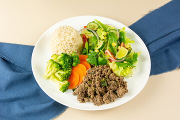 Healthy Plate with Ground Beef, Brown Rice, Vegetables, and Fresh Salad