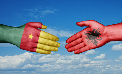 Cameroon and Albania country handshaking with flags, consensus concept international co-operation illustration