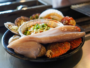 Grill seafood and various clams on fire