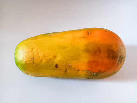 Ripe sweet California Papaya isolated on white background. Famous native Indonesian fruit for is sweetness.
