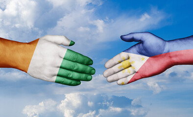 Philippines and Ivory Coast country handshaking with flags, consensus concept international co-operation illustration