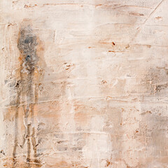 The background rubbed with various shades of beige, cream , ivory and brown. Structured and wiped background