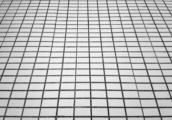 Low angle wall tiles texture in perspective backdrop