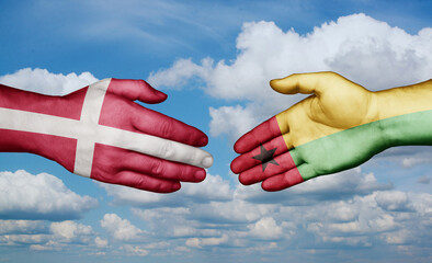 Guinea-Bissau and Denmark country handshaking with flags, consensus concept international co-operation illustration