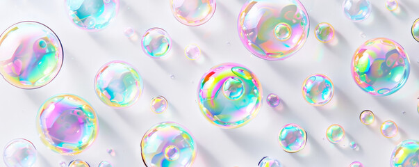 An array of iridescent bubbles of varying sizes scattered randomly on a clean white background, each bubble catching the light differently.