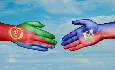 Haiti and Eritrea country handshaking with flags, consensus concept international co-operation illustration