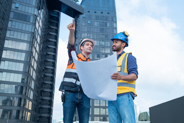 Technician Operating Control Panel in Industrial Setting