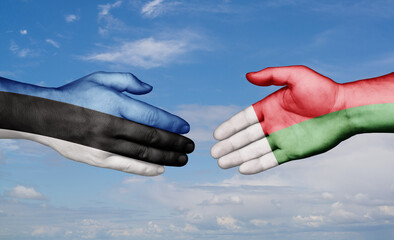 Madagascar and Estonia country handshaking with flags, consensus concept international co-operation illustration