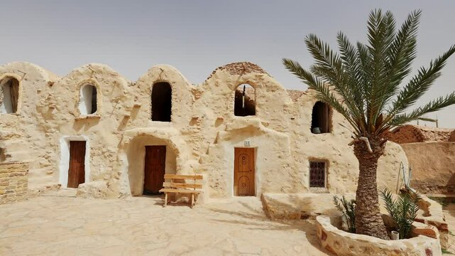 Traditional ancient Berber multi-level ghorfas adapted for hotel in village of Ksar Hadada. Timeless Tunisian architecture