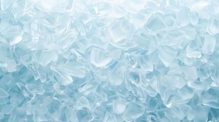 A close up of ice cubes in a blue background. The ice cubes are scattered throughout the image, creating a sense of movement and depth. The blue background adds a cool and calming effect to the scene