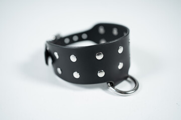 bdsm and fetish black leather neck choker collar on white background isolated