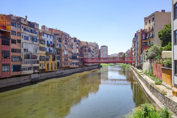 Girona, Spain - 23 July, 2024: Colored houses on River Onyar, Girona, Catalonia