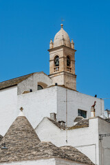 Trulli of Alberobello with Chiesetta Rettoria SS. Sacramento and S.Lucia,  a UNESCO heritage site.