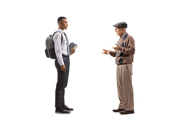 Elderly man talking to a college student