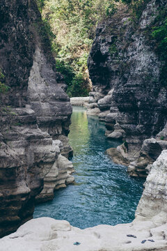 Tranquil water flows through a gorge at Air Terjun Tanggedu, Indonesia; Ndapayami, Kanatang, East Sumba Regency, East Nusa Tenggara, Indonesia