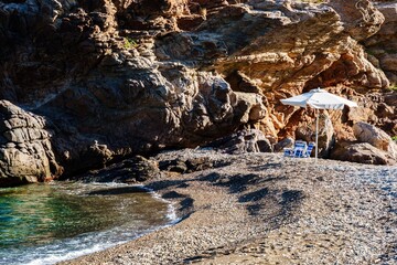 Lonely Beach with Parasol