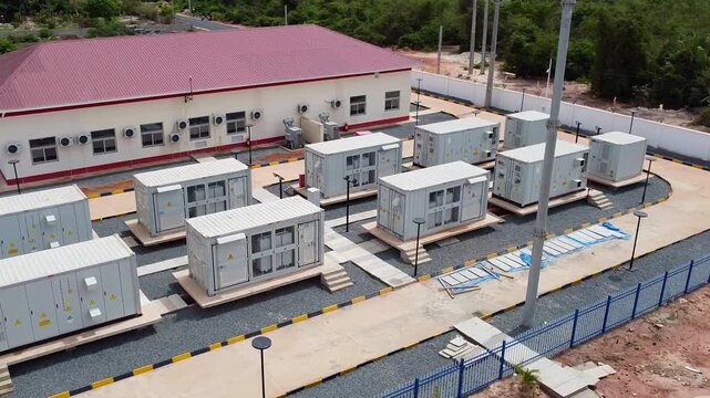Aerial view of battery energy storage system BESS array at renewable solar power farm in The Gambia, West Africa