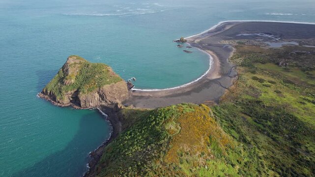 Aerial View Of Paratutae Island, Whatipu Beach, And Ninepin Rock In Auckland, North Island, NZ.