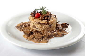 Risotto with dry Chilean mushrooms on a plate