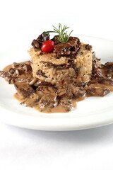 Risotto with dry Chilean mushrooms on a plate