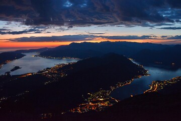 view from above of the Bay of Kotor at sunset. night city