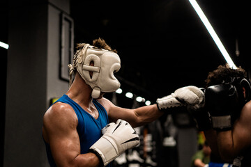 Boxers fighting in boxing training in the gym.
