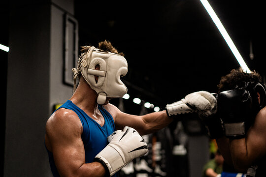 Boxers fighting in boxing training in the gym.