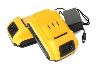 Fototapeta premium Batteries and charger for cordless drill isolated on white