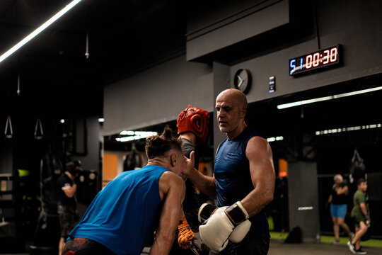 Boxers fighting in boxing training in the gym.