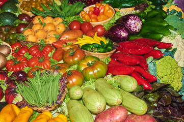 A vibrant variety of fresh vegetables and fruits arranged neatly, highlighting the freshness and healthy appeal of the produce.