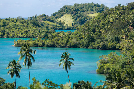 Tropical beauty in green and turquoise on an island and coastline in North Sulawesi, Indonesia; Borgo Satu, Belang, Southeast Minahasa Regency, North Sulawesi, Indonesia