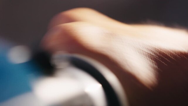 close up of caucasian biker hand twist accelerometer lever multiple time 