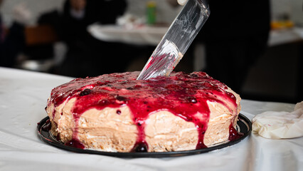 Sweet cream cake covered with red sauce