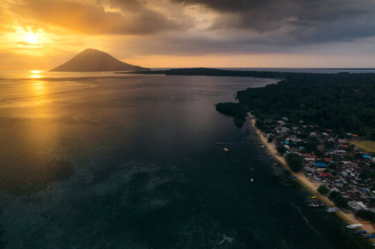 Drone view Bunaken island at sunset, North Sulawesi, Indonesia; Bunaken, North Sulawesi, Indonesia