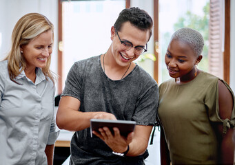 Creative team, tablet and discussion in office for plan, brainstorming and project in workplace. Graphic designer, women and tech in design studio for teamwork, idea and conversation for development