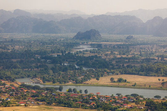 Picturesque view of a meandering river and lush landscape along Route 8 at Na Hin village in Central Laos; Na Hin, Khammouane Province, Laos