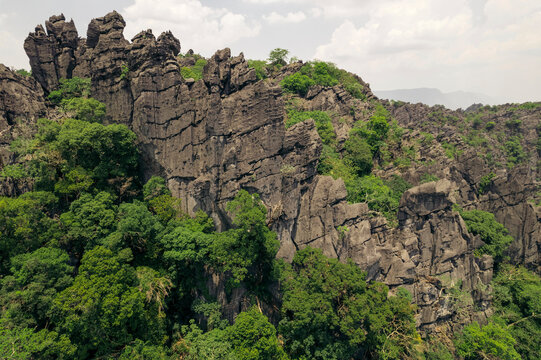 Limestone karst formations in sunset light in the Thakhek area of Laos; Thakhek, Khammouane Province, Laos