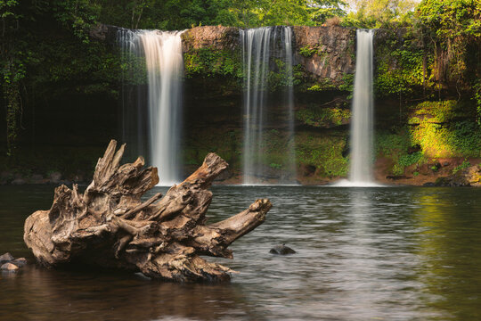 Long exposure of three waterfalls and lush foliage at Tad Champee waterfall along Vang Ngao River in Laos;  Paksong, Laos