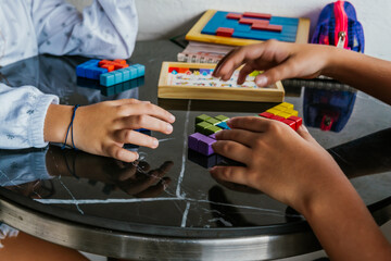 Latino children in glasses, studying and doing homework at home. Back to school. Childhood. Learning and skills.
