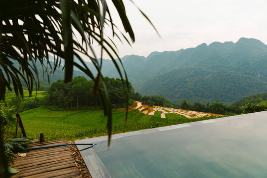 Picturesque scene of the lush countryside with rice terraces the view from an infinity pool in Thanh Hoa, Vietnam; Pu Luong, Thanh Lam, Ba Thuoc, Thanh Hoa, Vietnam