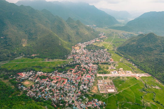 Aerial view of the town of Mai Chau in a foggy valley, Vietnam; Mai Chau, Tong Dau, Mai Chau, Hoa Binh, Vietnam
